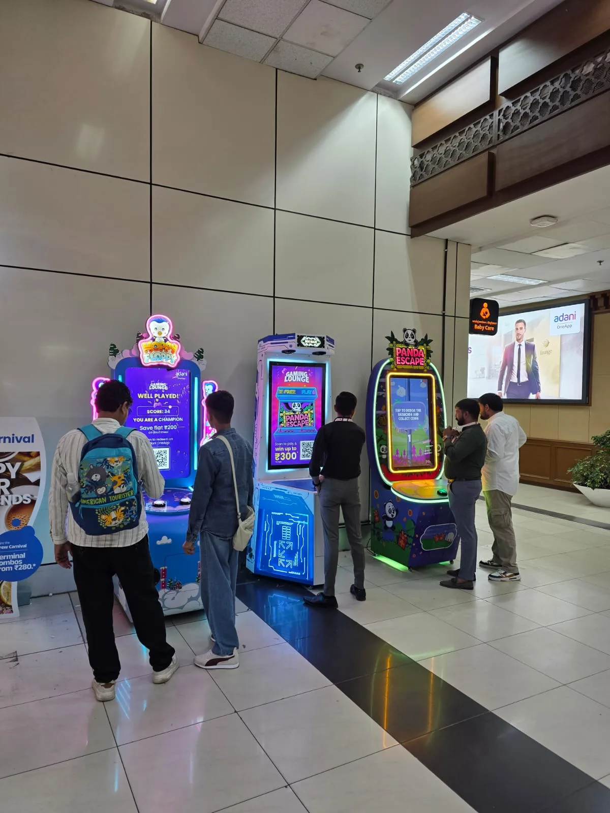 Two Hoppy Floppy redemption machines in a mall corridor with shoppers