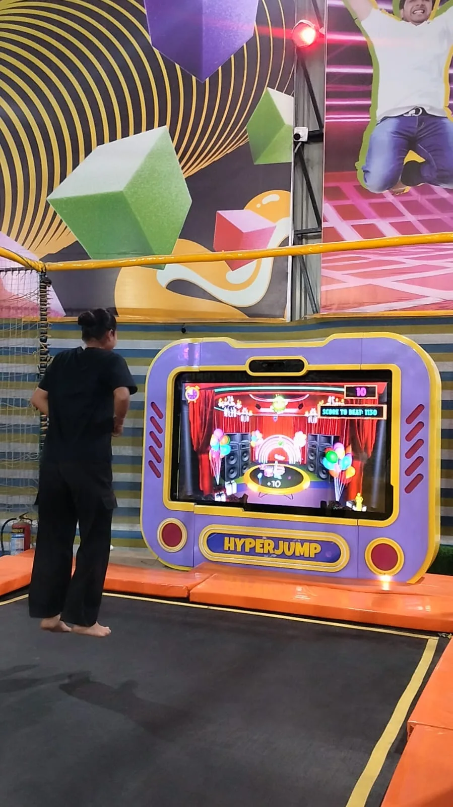 Player on a trampoline facing the Hyper Jump game screen