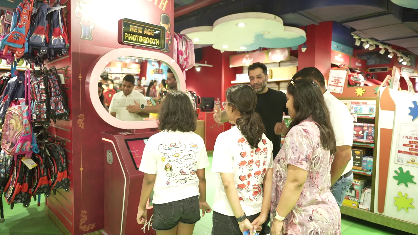 Family gathered at the Pikcha photo booth at Hamleys in Noida choosing a style