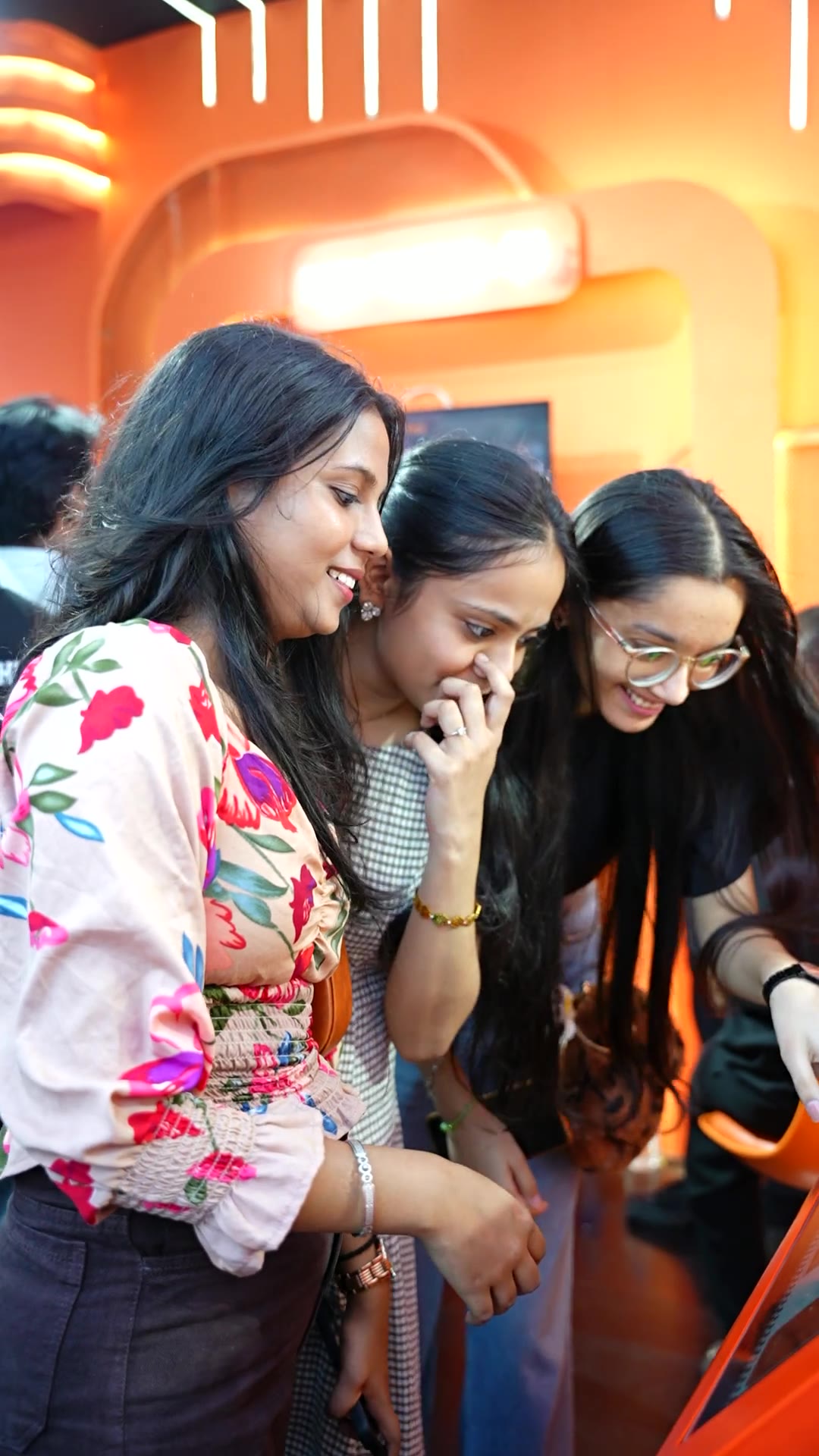 Guests posing, picking a look and taking their Pikcha prints